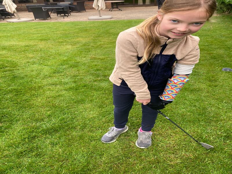 10-year-old Joanie Melady also tested out the new golfing arm, saying it was ‘really fun’