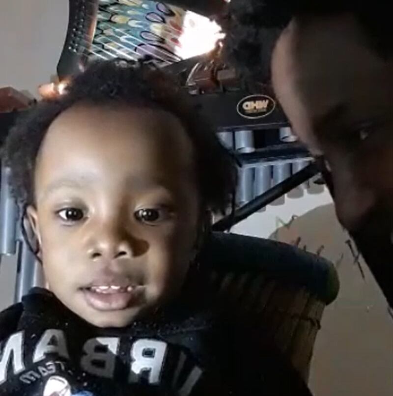 Abiyah Yasharahyalah, seen with his father in a video recorde at least a year before his death