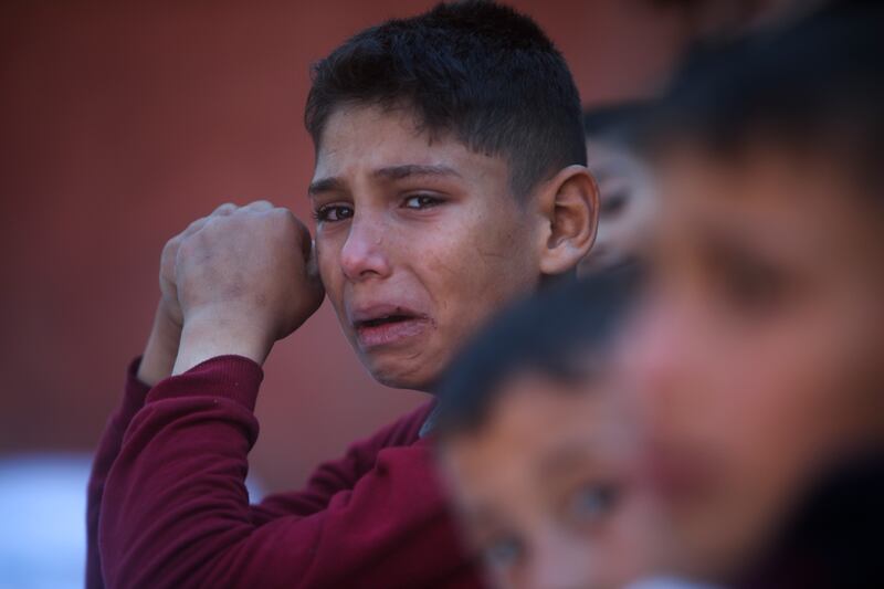 A Palestinian boy cries for his relatives who were killed in the Israeli bombardment of the Gaza Strip, at Nasser hospital in Khan Younis (AP Photo/Mohammed Dahman)