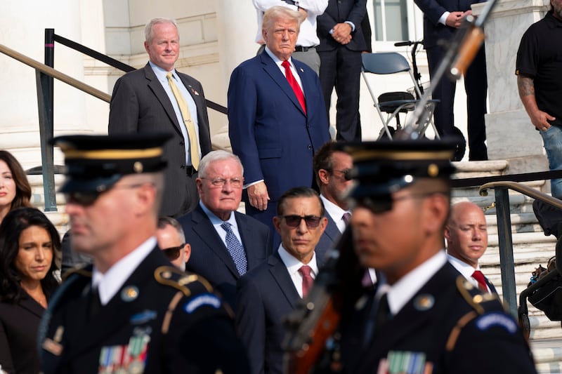 Bob Quackenbush, deputy chief of staff for Arlington National Cemetery, and Republican presidential nominee Donald Trump at the Tomb of the Unknown Solider (Alex Brandon/AP)