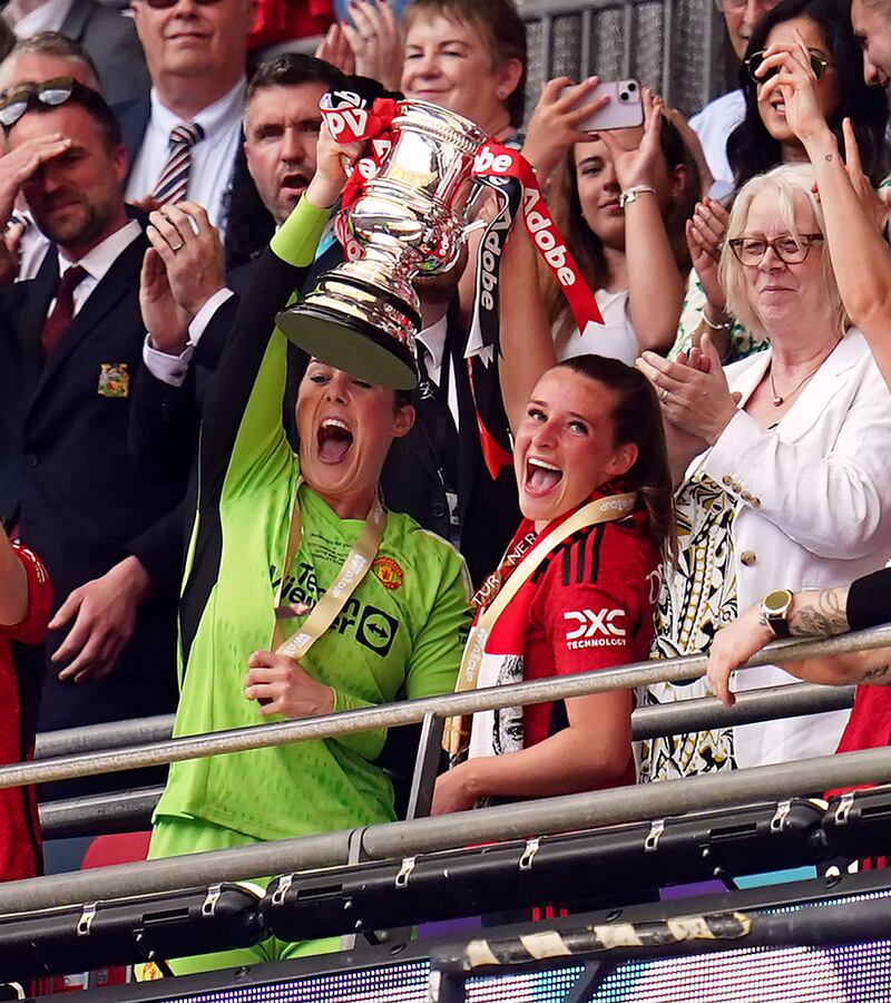 Earps (left) won the FA Cup at the end of her fifth season with United
