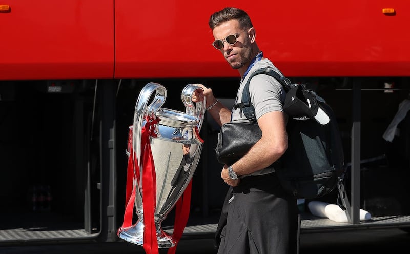 Henderson pictured with the Champions League trophy after the club won the competition in 2019
