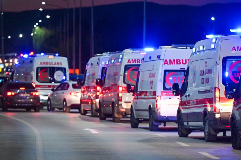 Ambulances wait in line outside of Turkish Aerospace Industries Inc on the outskirts of Ankara (AP)