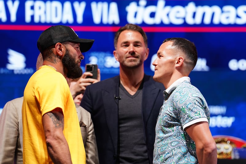 Anthony Cacace and Josh Warrington face off during Wednesday's press conference in London. Picture by PA