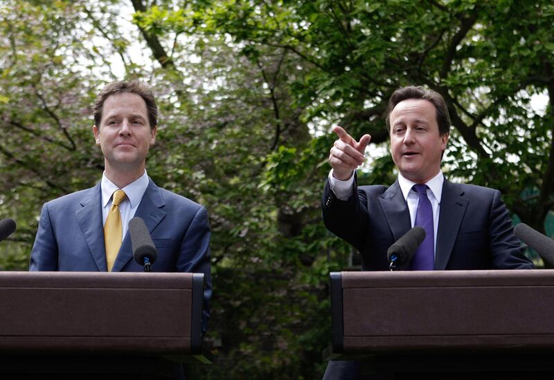 David Cameron and Nick Clegg hold their first joint press conference in the Downing Street garden