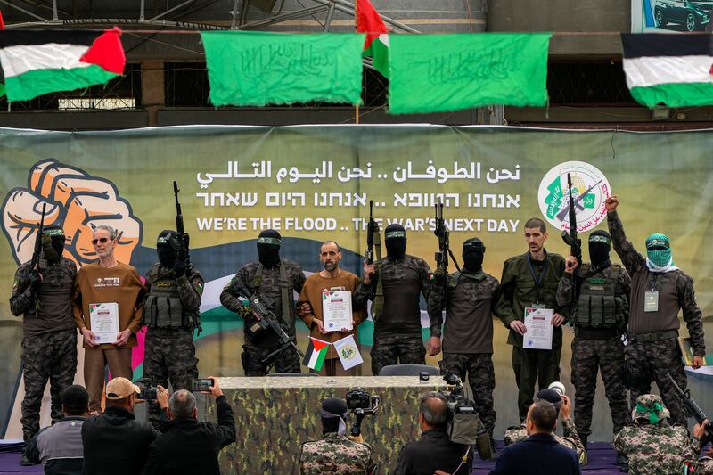 Israeli captives Ohad Ben Ami, Eli Sharabi and Or Levy were handed over to the Red Cross (Abdel Kareem Hana/AP)