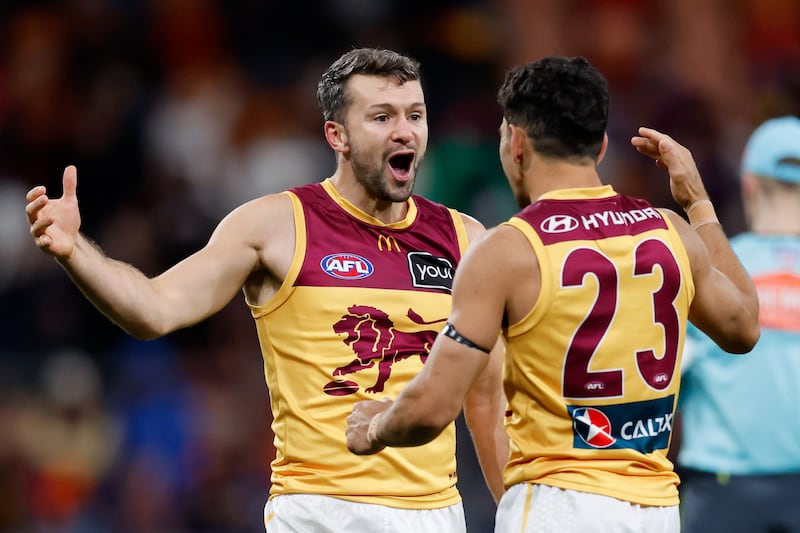 Conor McKenna and Charlie Cameron of the Lions celebrate after the siren during the 2024 AFL First Semi Final match between the GWS GIANTS and the Brisbane Lions at ENGIE Stadium on September 14, 2024 in Sydney, Australia. (Photo by Dylan Burns/AFL Photos via Getty Images)