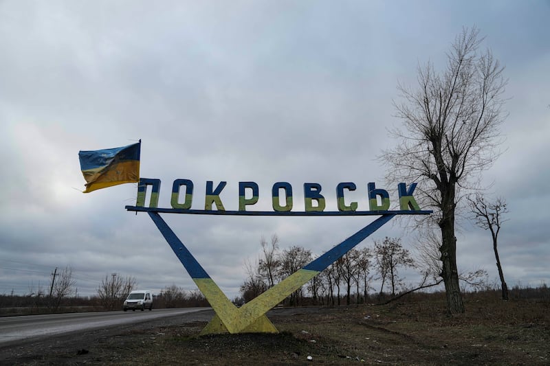 A car drives along a highway from Pokrovsk (Evgeniy Maloletka/AP)