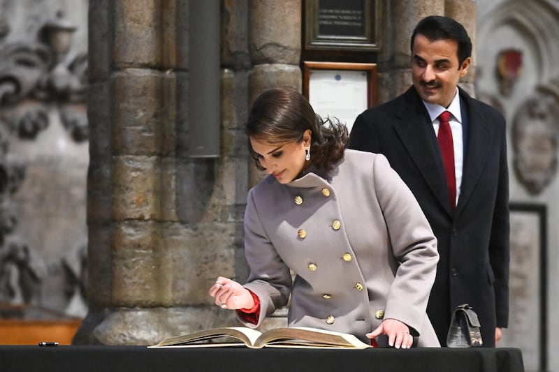 The Emir of Qatar Sheikh Tamim bin Hamad Al Thani and his wife Sheikha Jawaher, sign the guest book