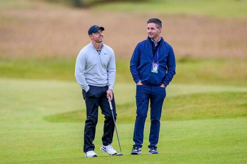 Rory McIlroy speaks with his manager, Sean O’Flaherty, during the Genesis Scottish Open Pro-Am