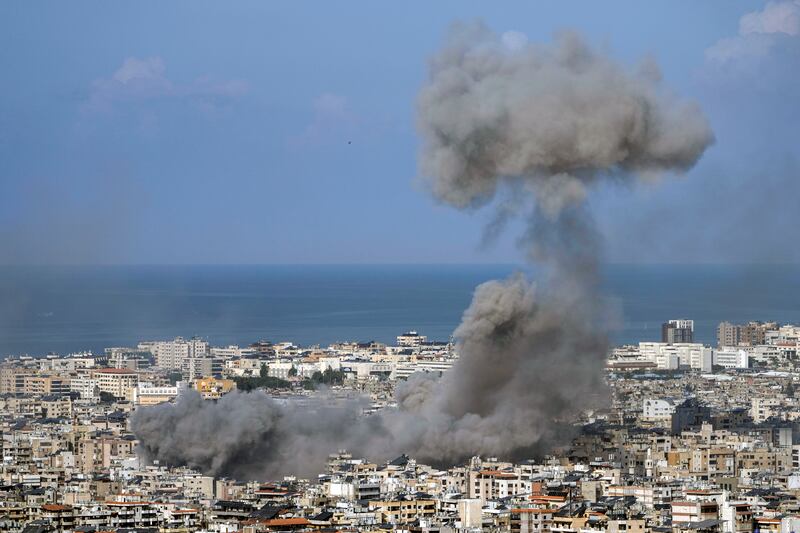 Smoke rises after an Israeli air strike on Dahiyeh (Bilal Hussein/AP)