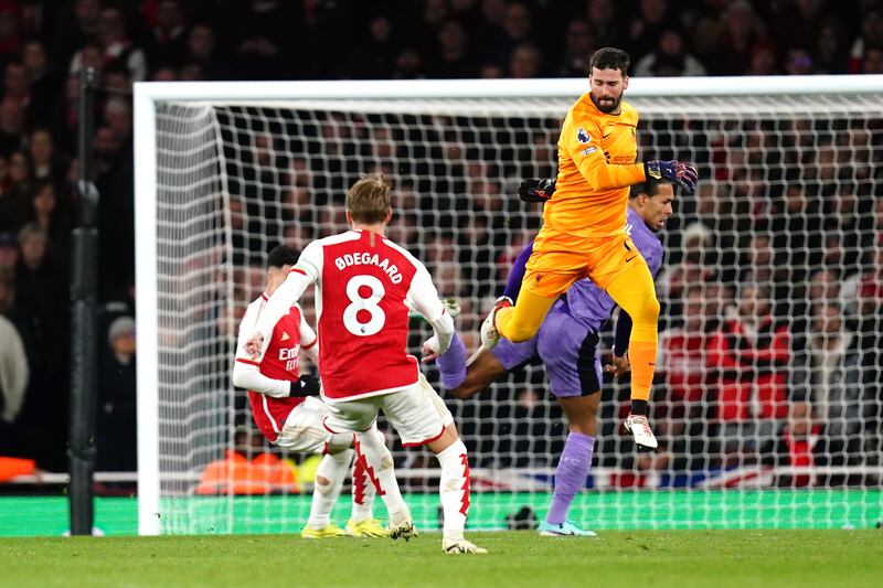 Gabriel Martinelli (left) scores after Alisson Becker and Virgil van Dijk’s mix-up