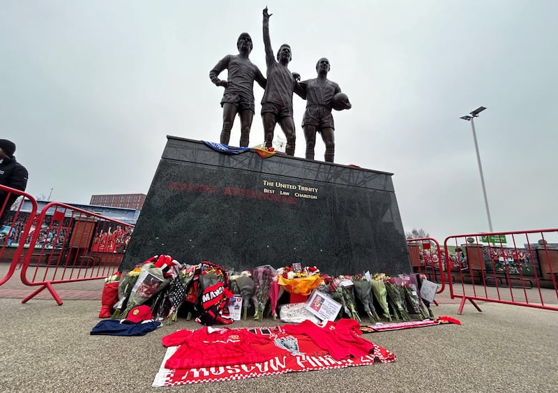 Tributes were laid outside Old Trafford in memory of Denis Law