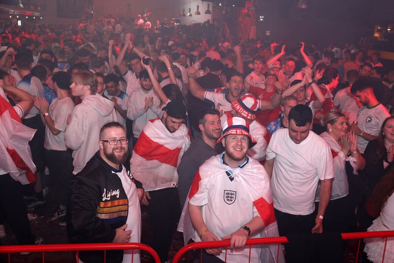 England fans celebrate at full-time at the Diecast, Manchester