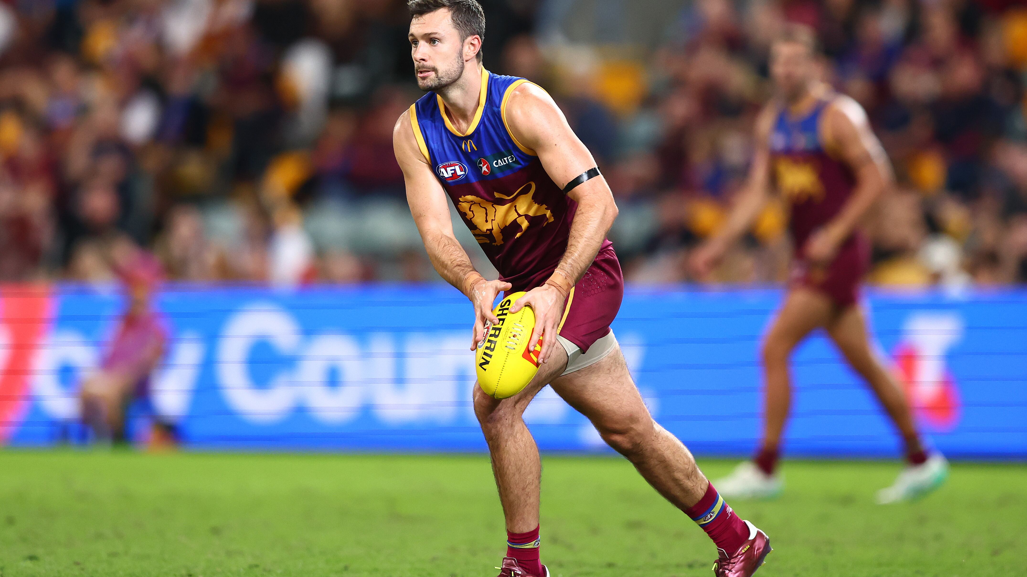 BRISBANE, AUSTRALIA - MAY 05: Conor McKenna of the Lions kicks during the round eight AFL match between Brisbane Lions and Gold Coast Suns at The Gabba, on May 05, 2024, in Brisbane, Australia. (Photo by Chris Hyde/AFL Photos/via Getty Images )