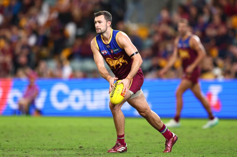 BRISBANE, AUSTRALIA - MAY 05: Conor McKenna of the Lions kicks during the round eight AFL match between Brisbane Lions and Gold Coast Suns at The Gabba, on May 05, 2024, in Brisbane, Australia. (Photo by Chris Hyde/AFL Photos/via Getty Images )