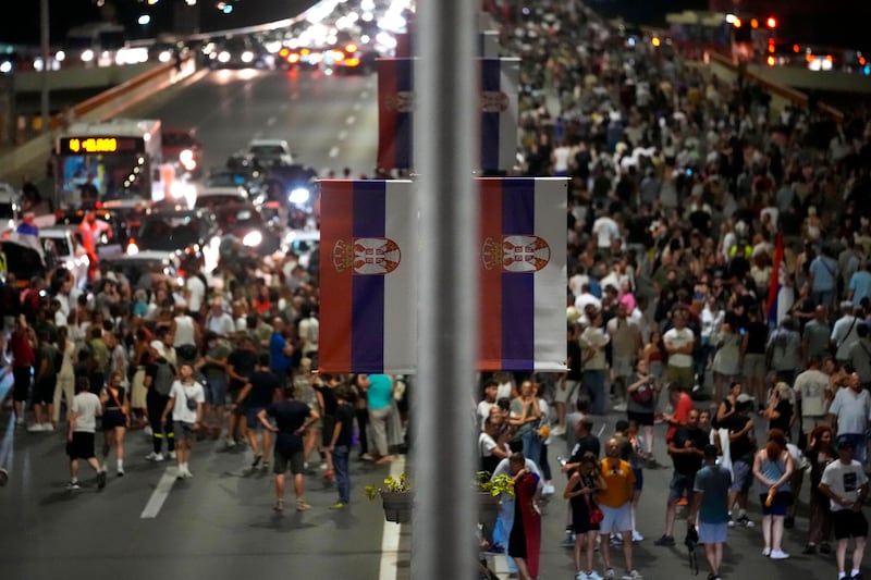 People block a highway in Belgrade during a protest against pollution and the exploitation of a lithium mine in Serbia (Darko Vojinovic/AP)