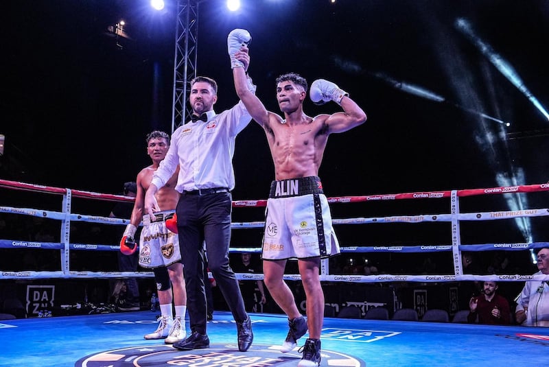 Teo Alin celebrates after his hand is raised following his debut six-rounder at the SSE Arena