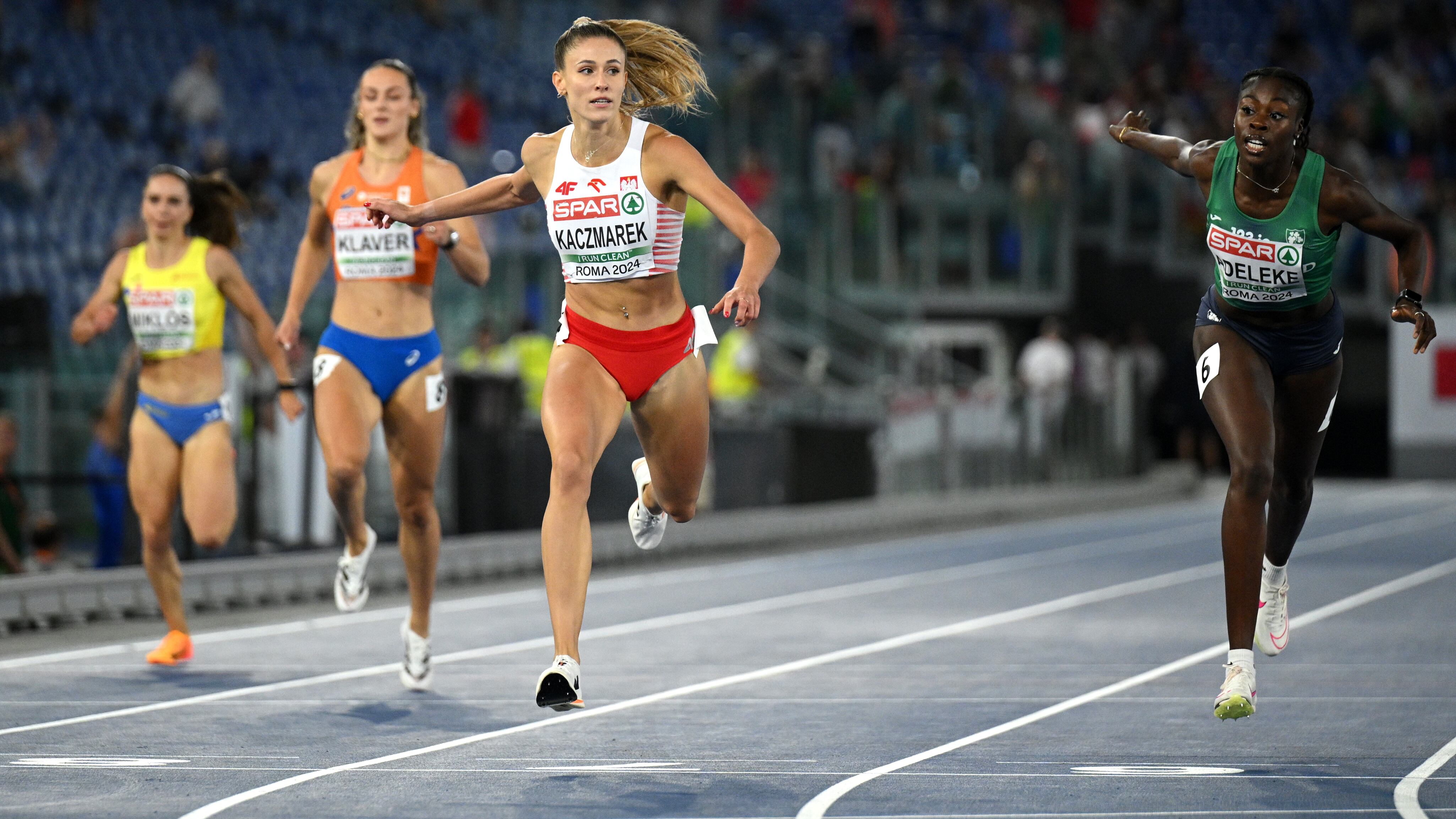 ROME, ITALY - JUNE 10: Gold medallist, Natalia Kaczmarek of Team Poland, crosses the finish line ahead of silver medallist,  Rhasidat Adeleke of Team Ireland and bronze medallist, Lieke Klaver of Team Netherlands to win in the Women's 400m Final on day four of the 26th European Athletics Championships - Rome 2024 at Stadio Olimpico on June 10, 2024 in Rome, Italy.  (Photo by Matthias Hangst/Getty Images)