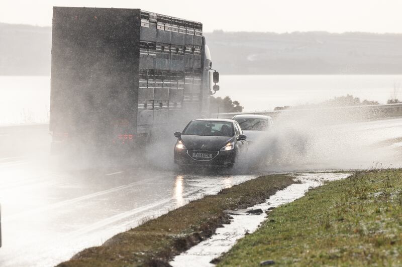 Vehicles on the A9 in Inverness, as snow, rain and wind warnings remain in place for the region on New Year’s Day