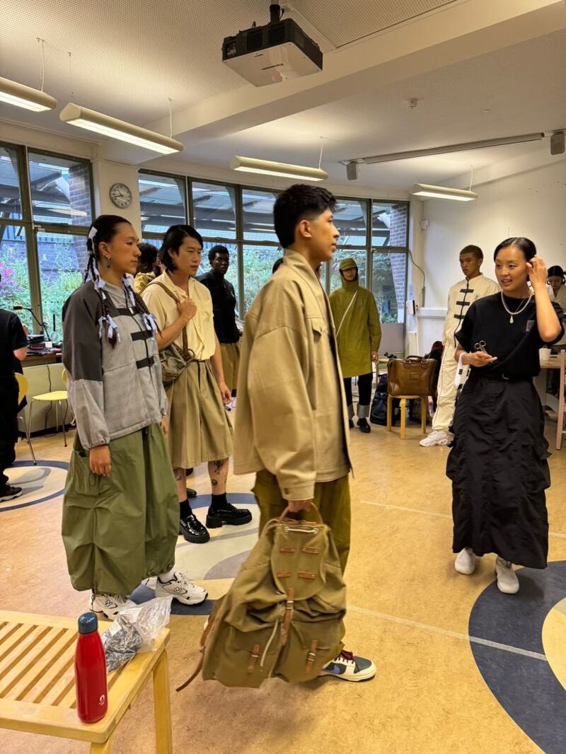 Founder of fashion brand Sum London, Margaret Sam, backstage with models of mixed Malaysian, Korean and British heritage ahead of her runway at the Museum of the Home (Margaret Sam)