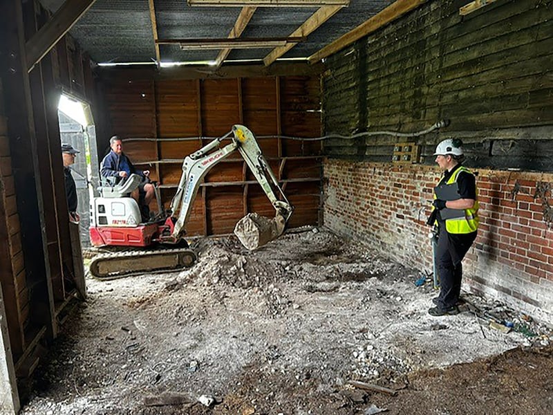 Police searching inside a barn at a Hertfordshire farm