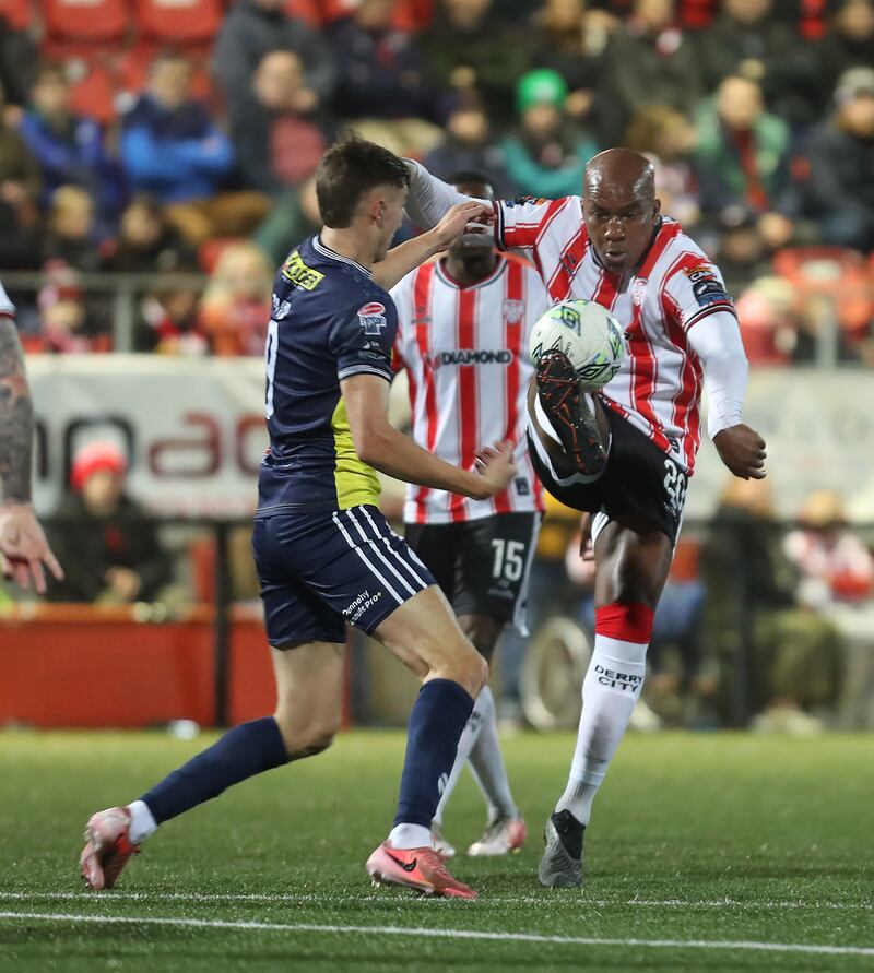 Derry City Andre Wisdom with Sean Boyd of Shelbourne during Friday nights match at the Brandywell