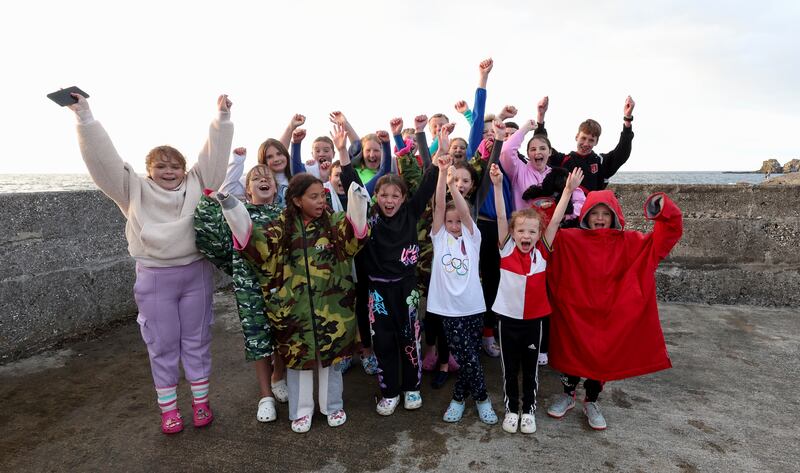 Supporters  of Daniel Wiffen cheer on while streaming on phones during a watch party  at Portmuck Bay for the Olympic 800m freestyle final on Tuesday evening.
PICTURE COLM LENAGHAN