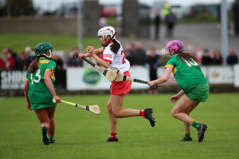 Loughgiel's Clare McKillop tries to evade the attention of Dunloy's Bronach Magill and Eohha McAllister during Sunday's Antrim Senior Camogie Championship final at Cushendall

Picture: Sean Paul McKillop