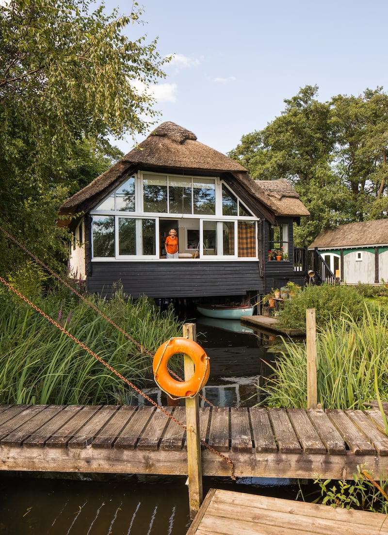 An exterior view of the thatched building Staithcote in Wroxham, Norfolk.