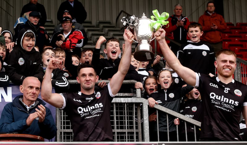 Kilcoo joint-captains Aaron Morgan and Darryl Branagan lift the Frank O'Hare Cup     in Sunday's Senior Football Final at Pairc Esler