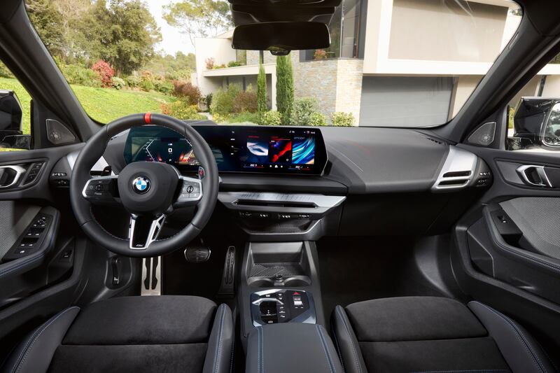 The interior features BMW’s Curved Display