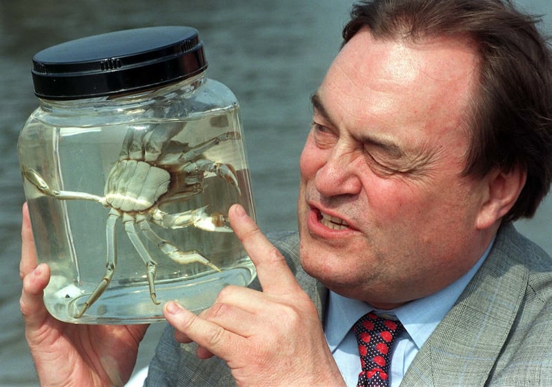 John Prescott taking a close look at a Chinese mitten crab