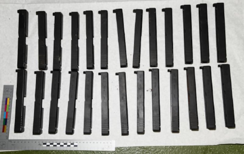 Handout image of firearms components including top slides and barrels for handguns were recovered by Border Force officers on July 7.