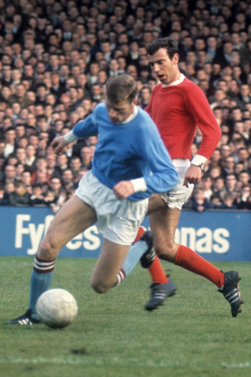 Tony Book in action for Manchester City .