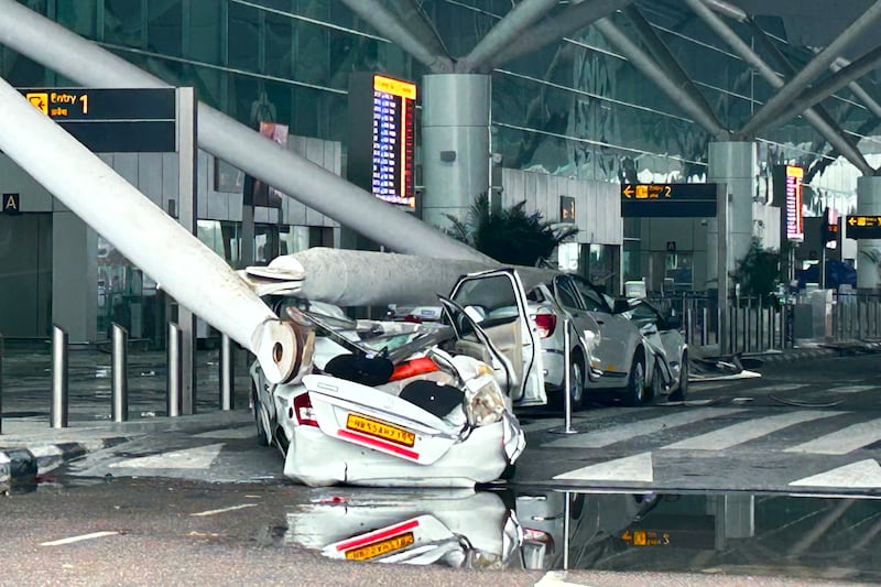 Cars in the pick-up and drop-off area of the terminal were damaged when support beams also collapsed (AP)