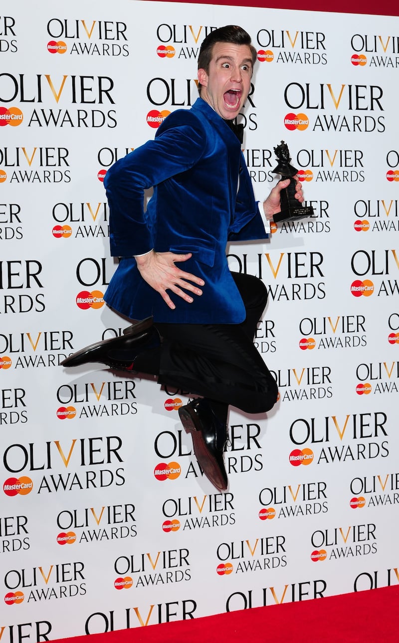 Gavin Creel wins the Olivier Award for Best Actor In A Musical for The Book Of Mormon, at the Royal Opera House in Covent Garden, London in 2014