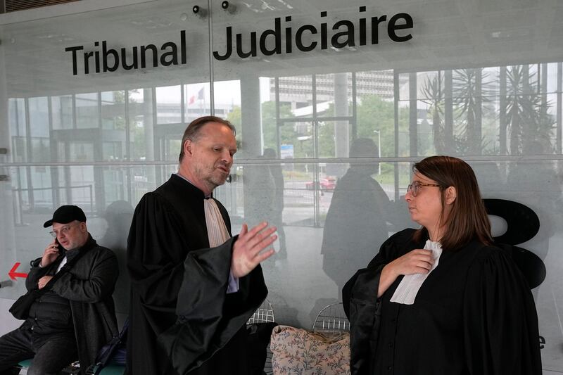 Gilles Moreu, left, and Lola Chunet, lawyers for Diego Maradona’s heirs, said they are ‘surprised and saddened’ by the ruling (Michel Euler/AP)