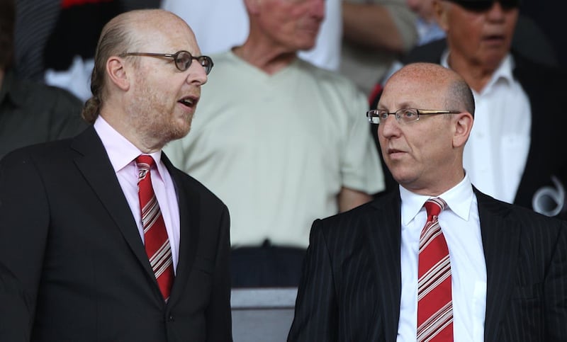 Manchester United directors Avram, left, and Joel Glazer