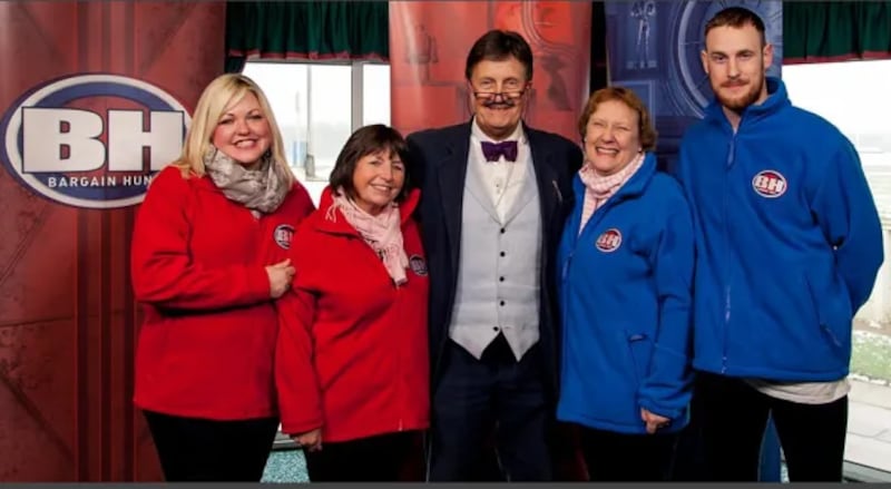 Contestants in blue and red on daytime TV show Bargain Hunt