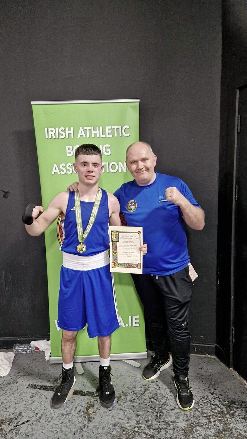 Erne&#39;s Rhys Owens celebrates Saturday&#39;s Irish U22 title triumph with coach Sean Crowley 