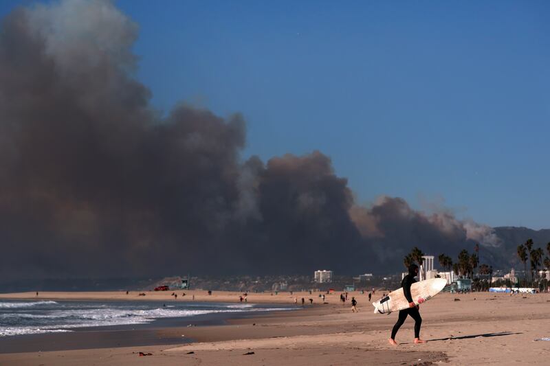 Smoke from a wildfire is seen from the Venice Beach section of Los Angeles (Jae C Hong/AP)