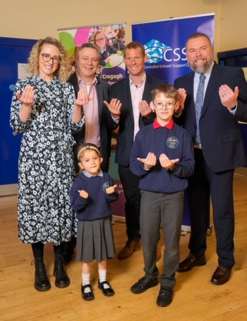 Tracey Woods, Schools’ Support Officer, Controlled Schools’ Support Council; Mark Baker, Chief Executive, Controlled Schools’ Support Council; Anthony Sinclair, Sign Language tutor; David Heggarty, Principal, Cregagh Primary School and pupils representing Cregagh Primary school.
