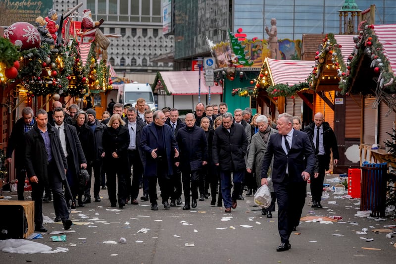 German Chancellor Olaf Scholz, centre, visited the scene of the tragedy in Magdeburg (AP Photo/Michael Probst)