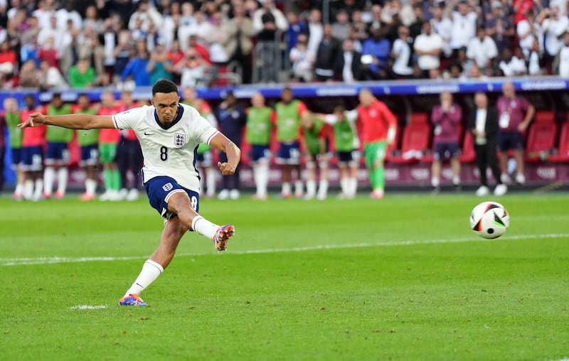 England’s Trent Alexander-Arnold scores the winning penalty in the shoot-out victory against Switzerland.