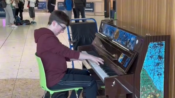 The teenager found time to delight travellers with an impromptu performance