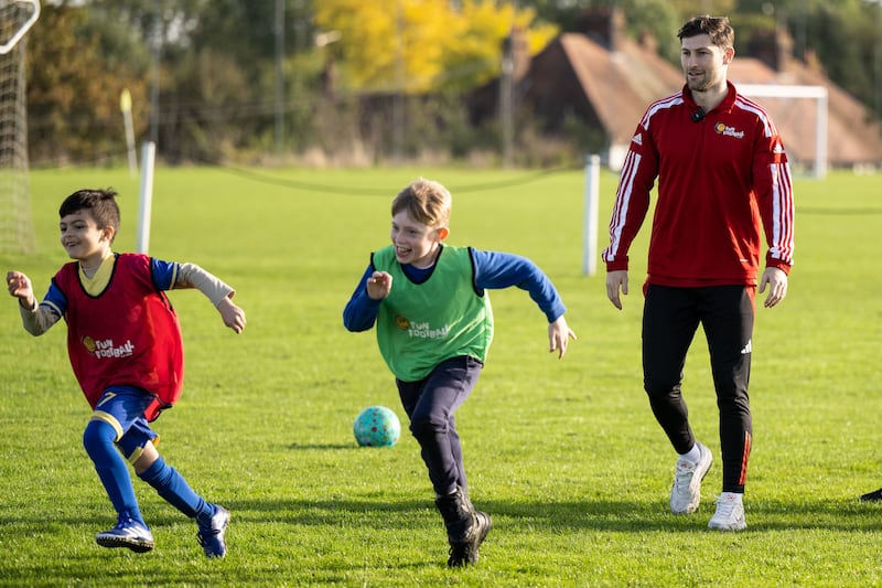 Ben Davies attends a football session for children as part of McDonald’s Fun Football programme at Cheshunt Football Club