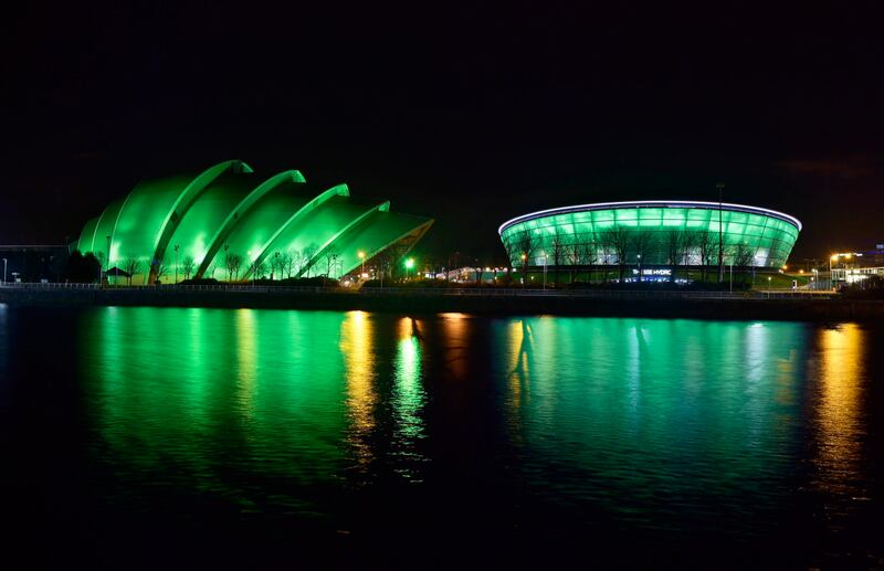 The SEC Armadillo and SSE Hydro are illuminated green in Glasgow by Tourism Ireland to mark St Patrick's Day (Sandy Young/PA)