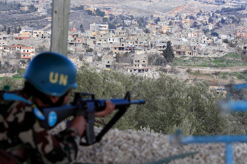 An UN peacekeeper takes position in Mays al-Jabal, southern Lebanon (Mohammed Zaatari/AP)