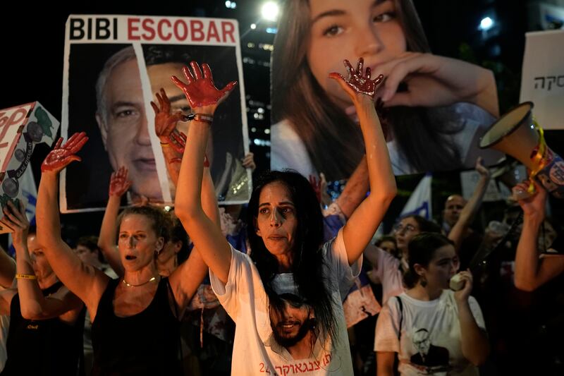 Einav Zangauker, centre, the mother of hostage Matan Zangauker, takes part in a protest in Tel Aviv, Israel (Tsafrir Abayov/AP)